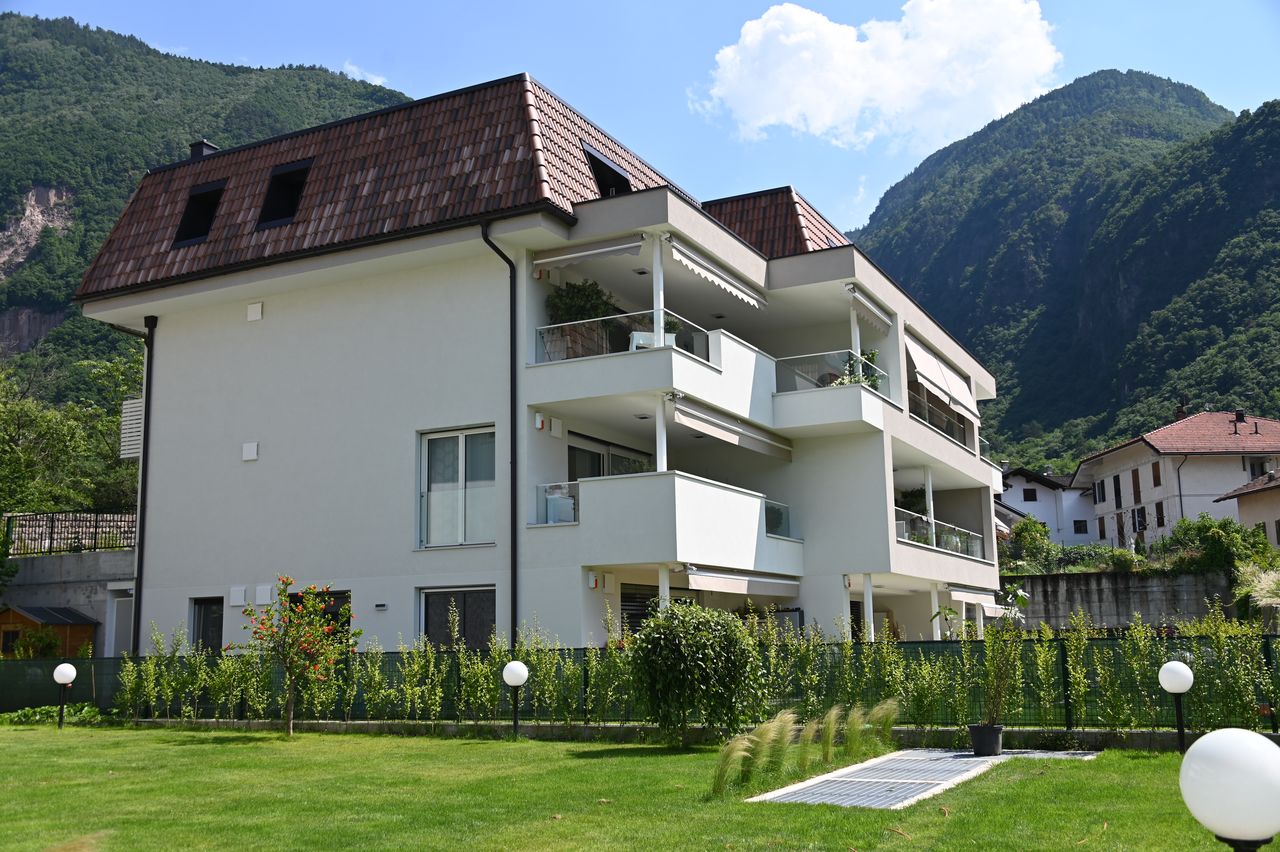 White house with external insulation in the mountains